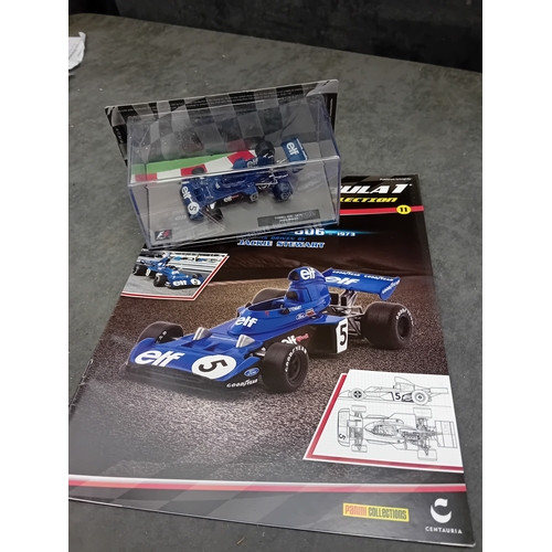 328 - A group of five die-cast Formula 1 model cars and accompanying magazines from the Panini Formula 1 T... 