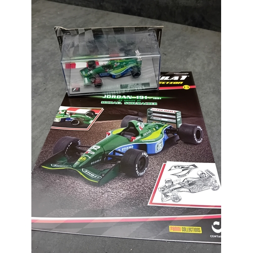 328 - A group of five die-cast Formula 1 model cars and accompanying magazines from the Panini Formula 1 T... 
