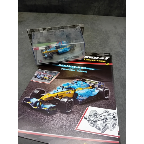 A group of five die-cast Formula 1 miniature car models from the Panini ...