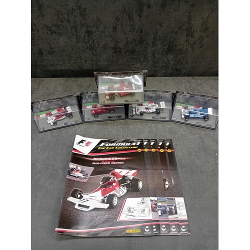 333 - A collection of five die-cast model cars from the 'FORMULA 1 The Car Collection' series, produced by... 