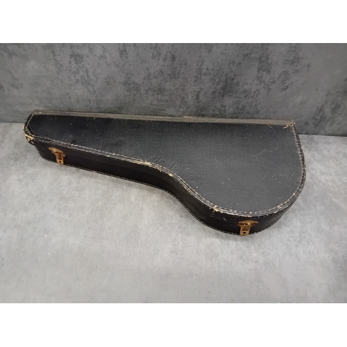 34 - A vintage four-string banjo-ukulele, or small tenor banjo, housed within its original, fitted hard-s... 