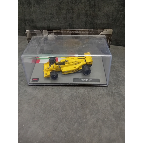 340 - A collection of 5 die-cast model Formula 1 racing cars from the 