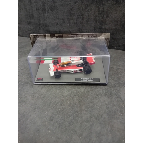 340 - A collection of 5 die-cast model Formula 1 racing cars from the 