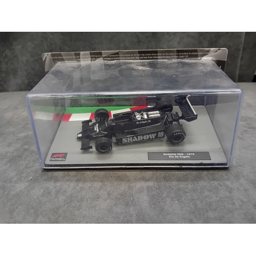 340 - A collection of 5 die-cast model Formula 1 racing cars from the 