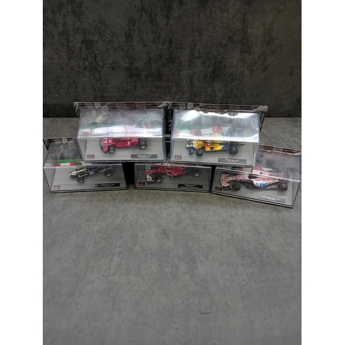 349 - A collection of five die-cast model cars from the 'Formula 1 The Car Collection' series, likely part... 