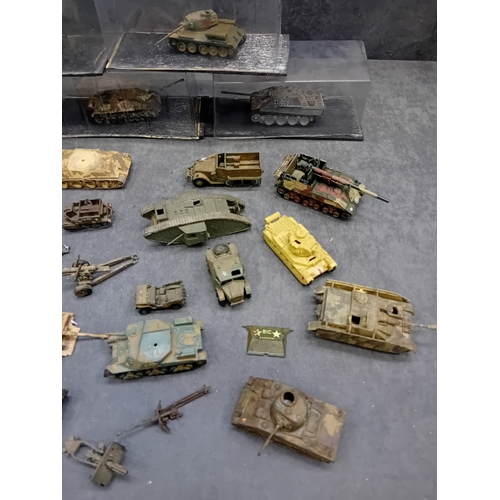 363 - A substantial collection of approximately 40-50 miniature military vehicles, predominantly tanks and... 
