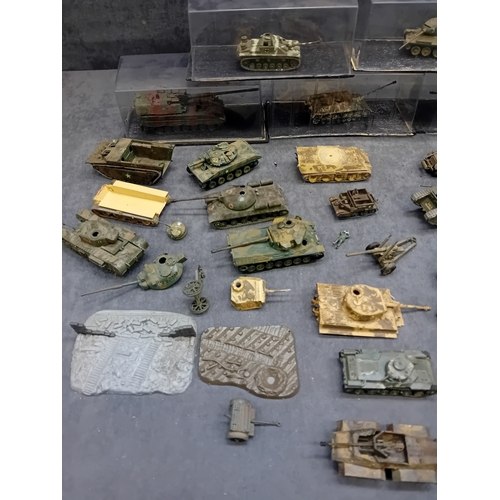 363 - A substantial collection of approximately 40-50 miniature military vehicles, predominantly tanks and... 
