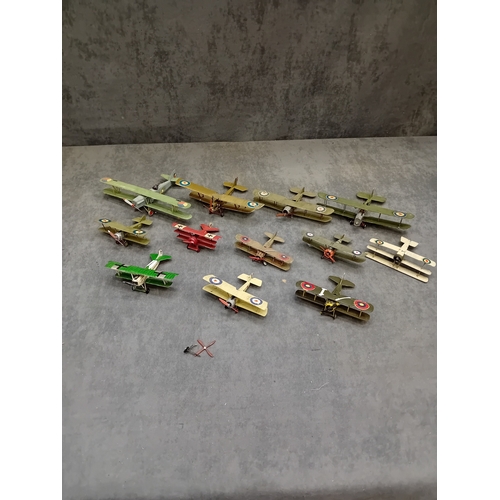 364 - A collection of approximately 14-15 miniature model aircraft, primarily biplanes and at least one tr... 