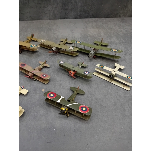 364 - A collection of approximately 14-15 miniature model aircraft, primarily biplanes and at least one tr... 