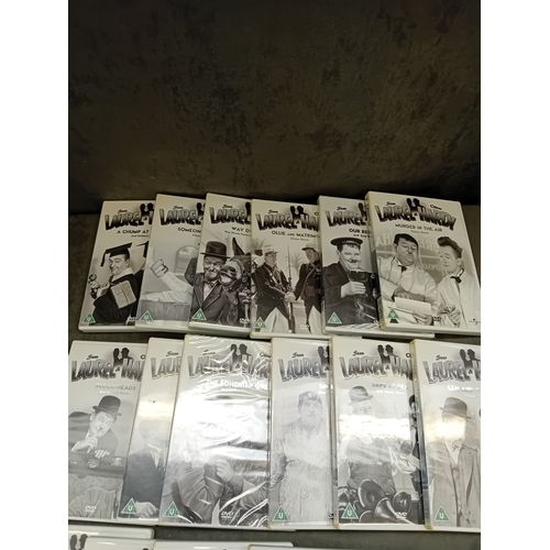 37 - A collection of 21 Laurel & Hardy DVDs, presented in standard plastic cases with photographic pa... 