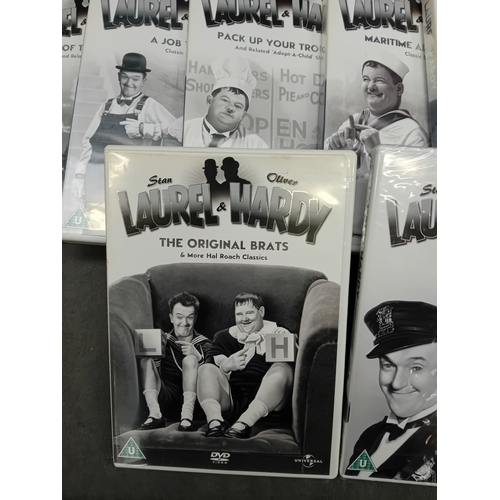 37 - A collection of 21 Laurel & Hardy DVDs, presented in standard plastic cases with photographic pa... 