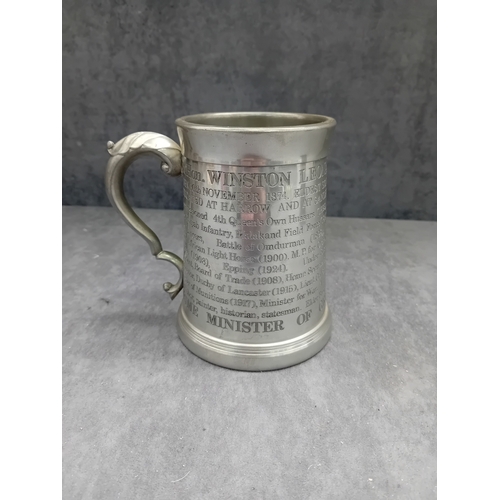 38 - A vintage commemorative Winston Churchill English pewter tankard. The tankard features an ornate han... 