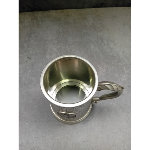 38 - A vintage commemorative Winston Churchill English pewter tankard. The tankard features an ornate han... 