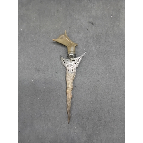 464 - A Malaysian silver Kris letter opener, exhibiting a wavy, damascened iron or steel blade, an ornate ... 
