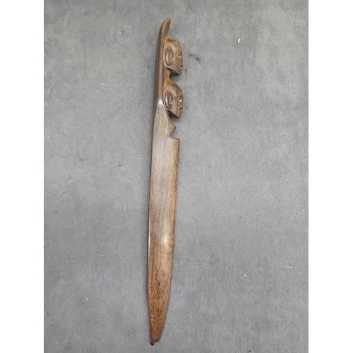 464 - A Malaysian silver Kris letter opener, exhibiting a wavy, damascened iron or steel blade, an ornate ... 