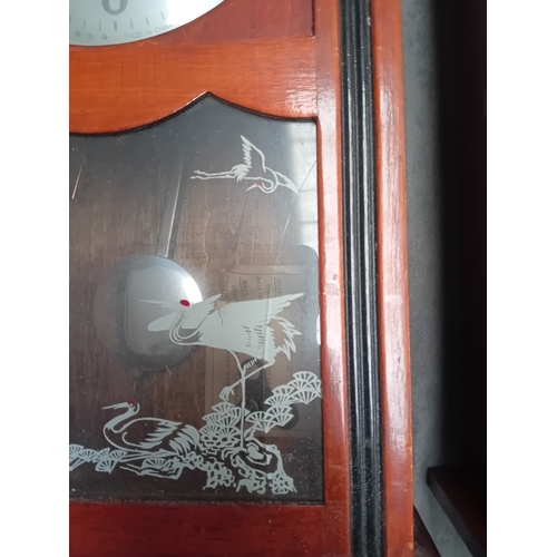 465 - A Matching pair of wall clock - Polaris Branding with oriental theme. one has minor glass damage as ... 