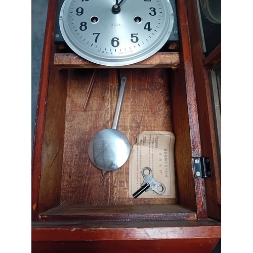 465 - A Matching pair of wall clock - Polaris Branding with oriental theme. one has minor glass damage as ... 