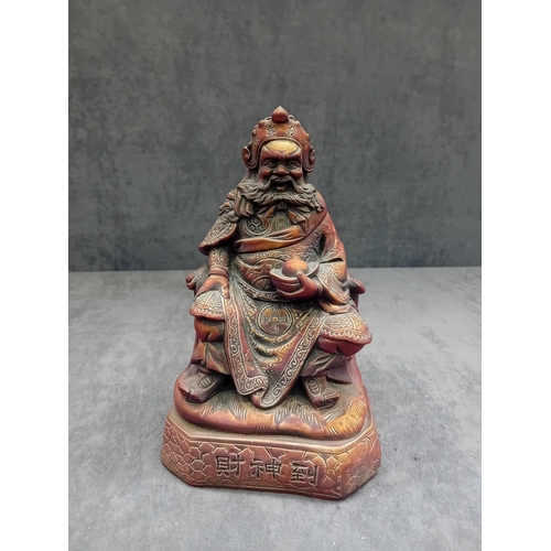 478 - A Chinese Guan Yu figure, depicting the seated deity or revered general in traditional East Asian st... 