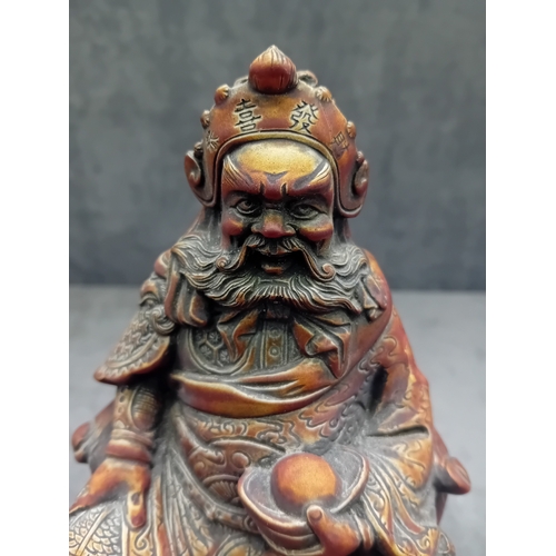 478 - A Chinese Guan Yu figure, depicting the seated deity or revered general in traditional East Asian st... 