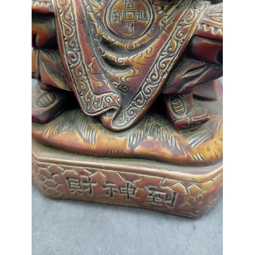 478 - A Chinese Guan Yu figure, depicting the seated deity or revered general in traditional East Asian st... 