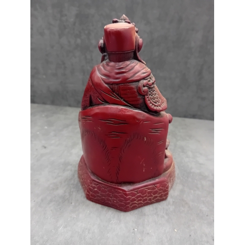 478 - A Chinese Guan Yu figure, depicting the seated deity or revered general in traditional East Asian st... 