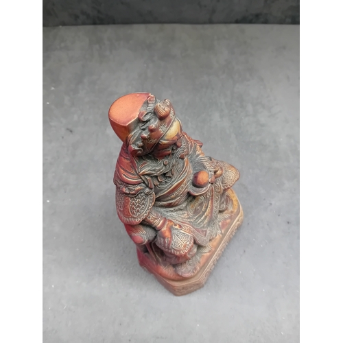 478 - A Chinese Guan Yu figure, depicting the seated deity or revered general in traditional East Asian st... 