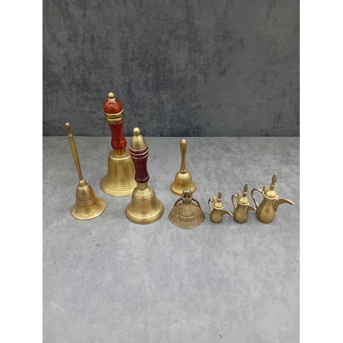 480 - This lot comprises a collection of nine decorative items, primarily constructed from a brass or bron... 