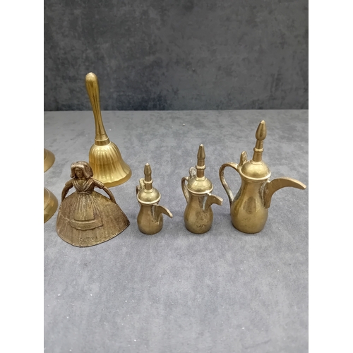 480 - This lot comprises a collection of nine decorative items, primarily constructed from a brass or bron... 
