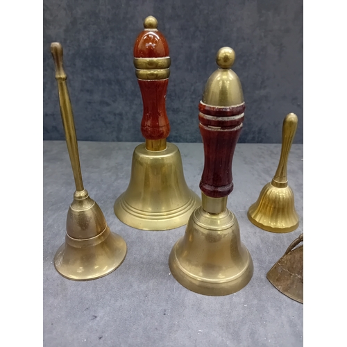 480 - This lot comprises a collection of nine decorative items, primarily constructed from a brass or bron... 