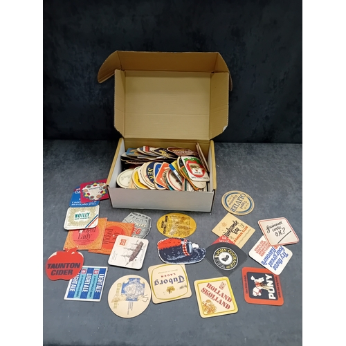 494 - A collection of approximately 50 vintage German beer coasters, primarily crafted from pulpboard or t... 