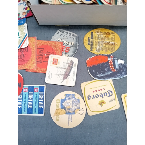 494 - A collection of approximately 50 vintage German beer coasters, primarily crafted from pulpboard or t... 