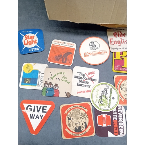 495 - A large collection of vintage beverage coasters, primarily crafted from absorbent pulpboard or cardb... 