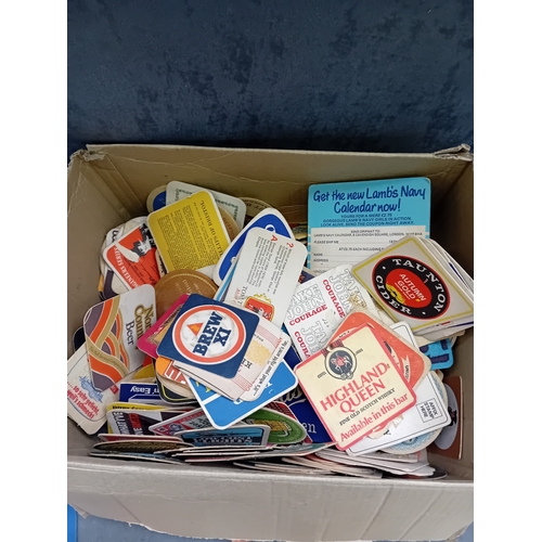 495 - A large collection of vintage beverage coasters, primarily crafted from absorbent pulpboard or cardb... 