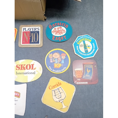 496 - A collection of vintage paperboard beverage coasters or beer mats, dating from the mid-to-late 20th ... 