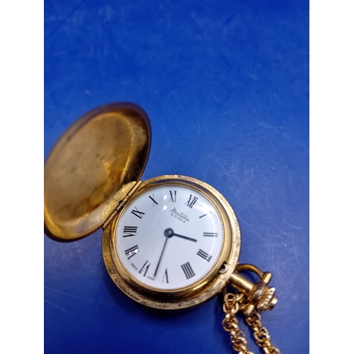 51 - A Bentima STAR hunter-case pocket watch crafted from gold-toned metal, accompanied by a matching cab... 