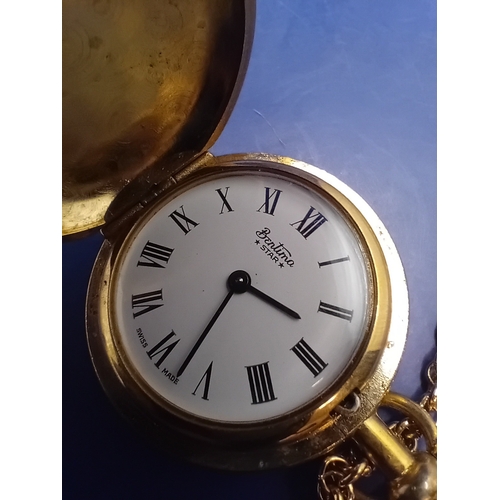 51 - A Bentima STAR hunter-case pocket watch crafted from gold-toned metal, accompanied by a matching cab... 
