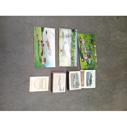 512 - This lot comprises a collection of vintage matchbooks and three larger associated aviation-themed ca... 