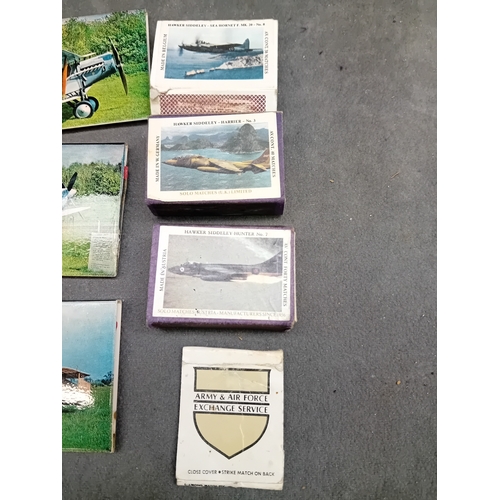 512 - This lot comprises a collection of vintage matchbooks and three larger associated aviation-themed ca... 