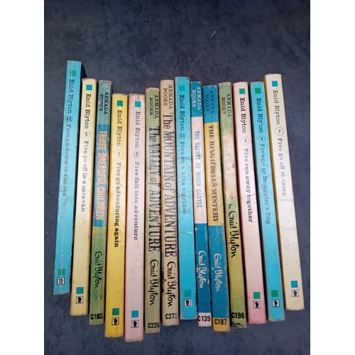 560 - A collection of fourteen mass-market paperback books authored by Enid Blyton, published by Armada Bo... 