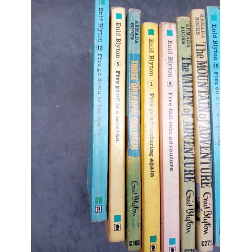 560 - A collection of fourteen mass-market paperback books authored by Enid Blyton, published by Armada Bo... 