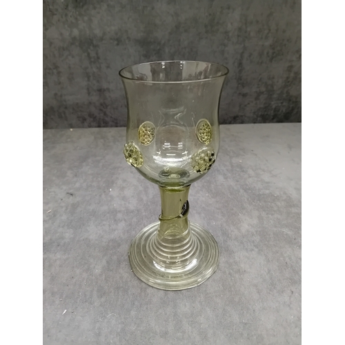 579 - Possibly A 17th Century Dutch Roemer Wine Glass, crafted from light greenish-tinted glass. The vesse... 
