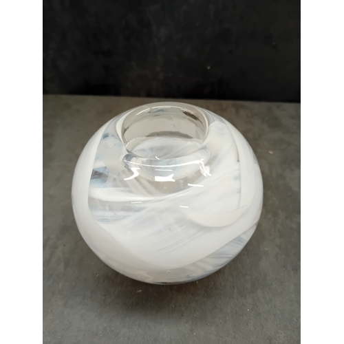 584 - The first object is a stylized, fluted glass vessel, resembling a handbag or purse. It is crafted fr... 