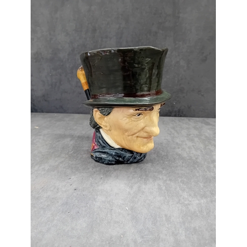 585 - A Royal Doulton 'John Peel' character jug, crafted from polychrome glazed ceramic. The jug depicts a... 