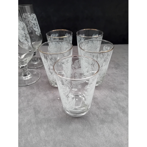 607 - A collection of 20 clear glass drinking vessels, likely dating to the mid-20th century, comprising t... 