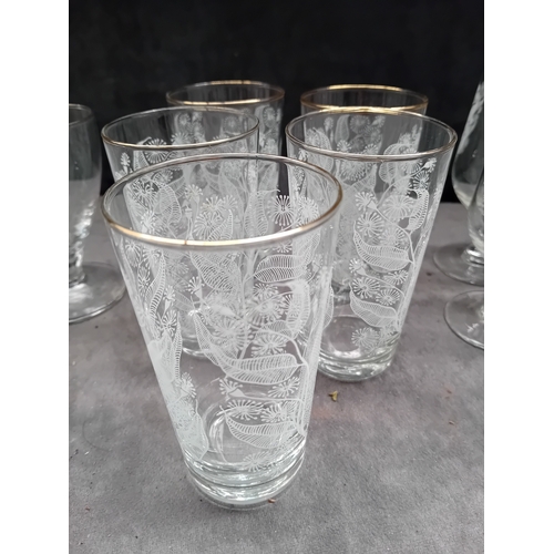 607 - A collection of 20 clear glass drinking vessels, likely dating to the mid-20th century, comprising t... 