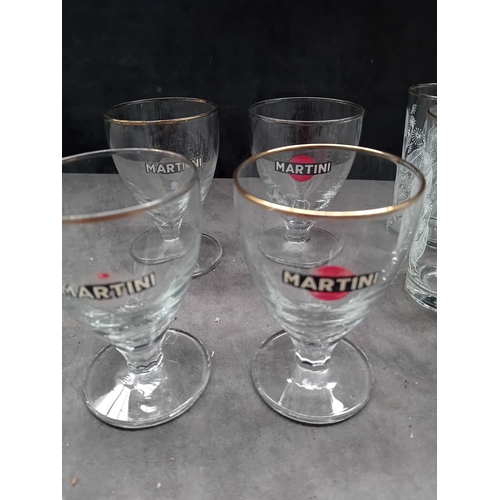 607 - A collection of 20 clear glass drinking vessels, likely dating to the mid-20th century, comprising t... 