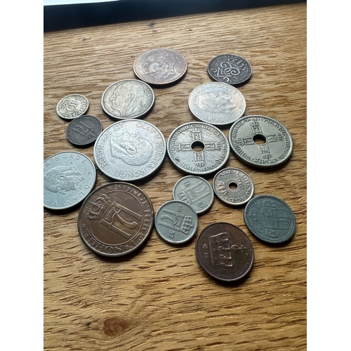 626 - A collection of approximately 25 assorted Norwegian coins, as indicated by the prominent 