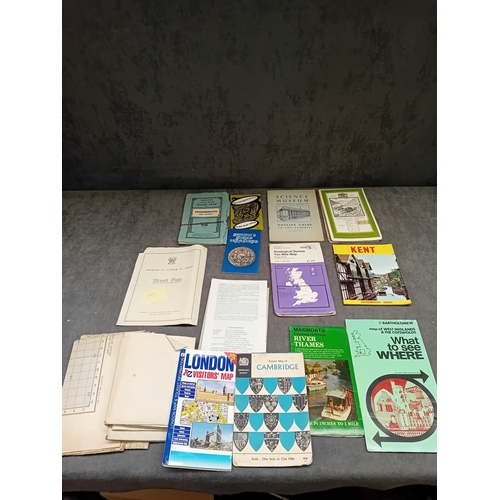 657 - A collection of approximately eighteen vintage paper ephemera, primarily consisting of British road ... 