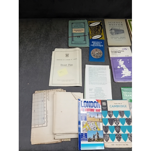 657 - A collection of approximately eighteen vintage paper ephemera, primarily consisting of British road ... 