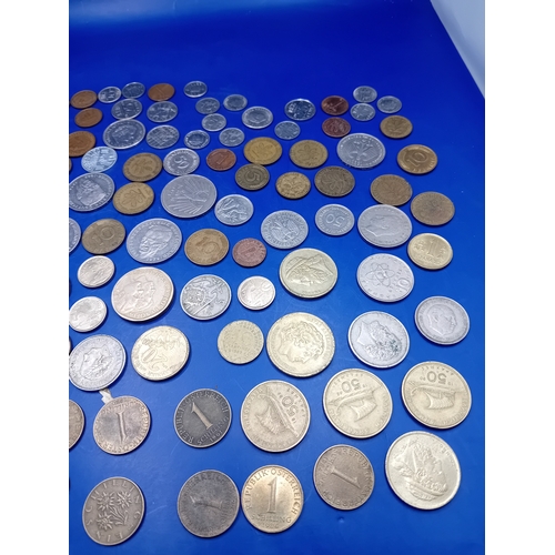 664 - A large collection of 136 assorted foreign coins from various global origins. The collection include... 